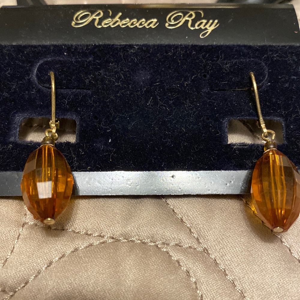 Rebecca Ray earrings pierced